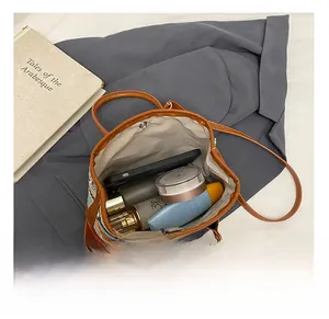 Top view of woven bucket bag interior showing large capacity for phone and cosmetics