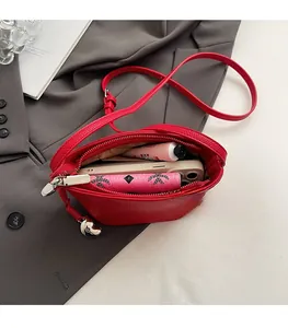 Interior view of red lychee grain leather bucket bag showing spacious storage capacity