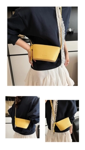 Detail of yellow lychee grain leather bucket bag showing front, back and side views