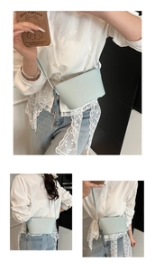 Detail of light blue lychee texture bucket bag with cute silver bear charm and strap