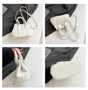 Detail shots of white lychee leather bucket bag with silver buckle and adjustable strap