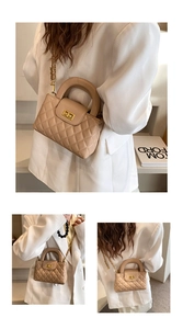 Detail of apricot quilted texture with metallic twist lock and gold chain strap