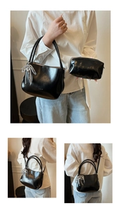 Detail of black faux leather bucket bag with silver rhinestone bow and matching inner pouch