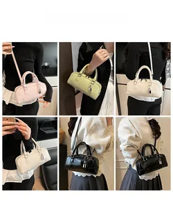 Detailed views of the Boston handbag in pink, green, white, and black with metal lock details