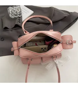 Detailed interior of a pink Boston bag showing large capacity for essentials
