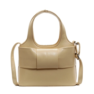 Sac à main beige élégant avec nœud décoratif, poignée et bandoulière amovible