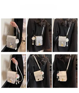 Detailed views of crossbody phone bag with adjustable strap and fluffy white charm