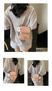 Pink PU mini crossbody phone bag with fluffy white doll keychain and shoulder strap