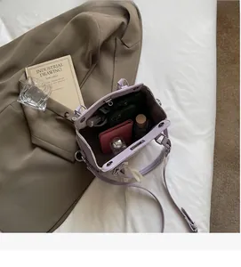 Interior view showing large storage capacity of lavender leather crossbody bag