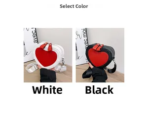 Detail of heart-shaped contrast crossbody bags in white-red and black-red PU leather