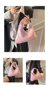 Detail of light pink patent leather geometric handbag with silver metal chain strap