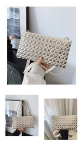 Detailed view of beige PU leather shoulder bag featuring symmetrical silver punk studs