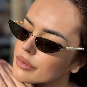 Vintage rimless cat eye sunglasses with brown lenses and elegant gold pearl temple arms