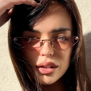 Retro rimless cat-eye sunglasses for women with pink gradient lenses and gold nose bridge