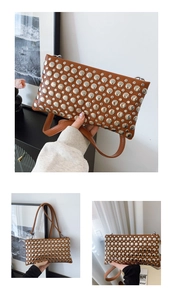Detailed view of brown matte leather handbag featuring silver dome studs and slim shoulder strap