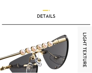 Detail view of cat eye sunglasses with gold temples and white pearl embellishments