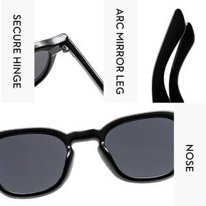 Detail view of secure hinge, arc mirror legs, and comfortable nose pads on black sunglasses