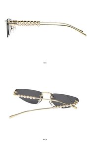 Detail of cat eye sunglasses featuring gold temples adorned with white pearls