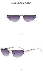 Detail view of silver rimless cat-eye sunglasses with pearl accents on metal temples