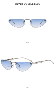 Detail view of silver cat-eye sunglasses with blue gradient lenses and pearl-decorated temples