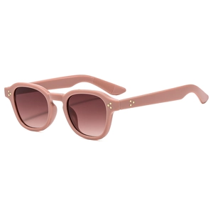 Retro round pink sunglasses with dark brown gradient lenses and gold rivet accents