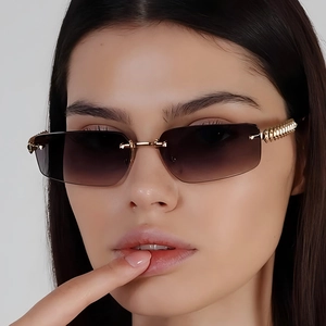 Fashionable rimless rectangle sunglasses with gradient lenses and textured gold metal temples