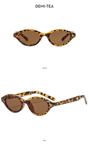 Detail view of vintage oval sunglasses in demi-tea tortoiseshell with smooth finish