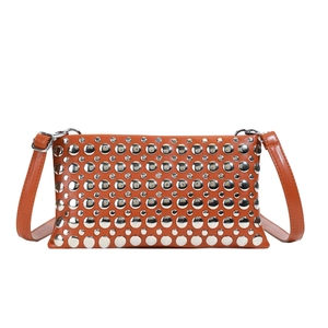 Brown rivet shoulder bag with silver studs and adjustable strap on a white background