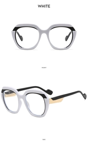 Detailed view of bicolor black and white oversized frames with gold metal hinges