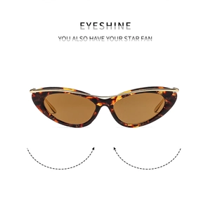 Détails de lunettes œil-de-chat écaille de tortue avec barre dorée et verres marron foncé