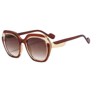 Fashionable oversized butterfly cat-eye sunglasses with two-tone amber and champagne frames