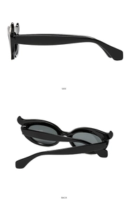 Detail view of black bat-wing cat eye sunglasses showing side and back frame structure