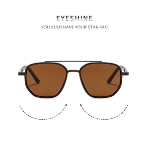 Close-up of double-bridge polarized sunglasses with dark metal frame and brown lenses