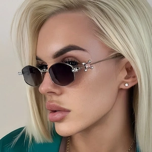 Chic silver polygonal sunglasses with gradient lenses worn by a model in a close-up profile