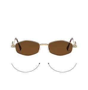 Macro detail of gold metal hinge with sparkling crystal inlay on hexagon sunglasses