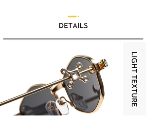 Detail of golden metal sunglasses frame with rhinestone cross hinge and light texture