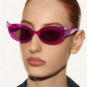 Fashion cat eye sunglasses for women with purple translucent frames and silver dot accents
