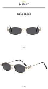 Detailed front and side view of gold hexagonal sunglasses with cross crystal temples