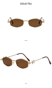 Detail of gold-tea polygon sunglasses featuring crystal-encrusted cross hinges and metal frame