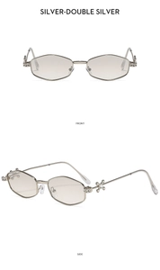 Detail of silver hexagonal sunglasses with star rhinestone inlay on metal temples