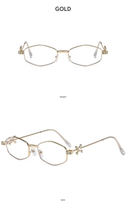 Detail of gold geometric hexagonal sunglasses featuring rhinestone inlaid cross on temples
