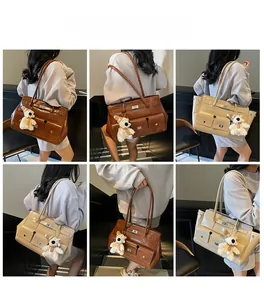 Detail showing large capacity shoulder bags in coffee and beige with plush bear pendant