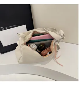 Interior view showing the large capacity of the creamy white tote bag for daily essentials