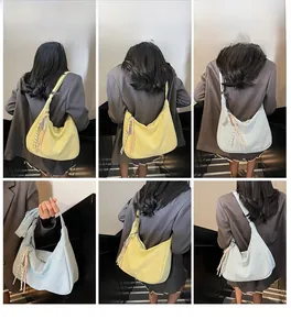 Detail view of large soft PU tote bags in yellow and blue with colorful woven straps