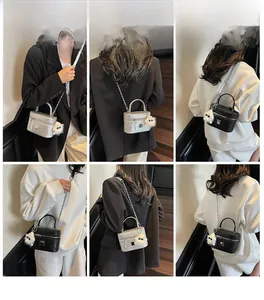 Collage of woven texture box bags in silver and black with chain straps and plush charm