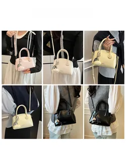 Multiple views showing compact crossbody bags in various colors with heart charms