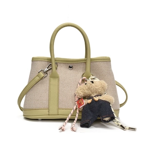 Canvas and light green leather bucket bag with cute teddy bear charm pendant