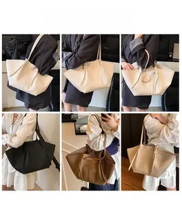 Detail shots showing the large tote bag with a unique winged silhouette and long straps