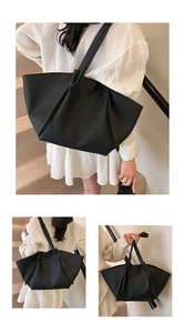 Three-way view of a large black tote bag showing spacious design and pebble texture leather