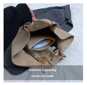 Large beige tote bag interior view with inner pouch and spacious storage capacity